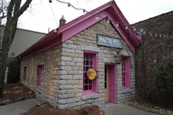 The Justus Ramsey House sits on the patio of St. Paul’s Burger Moe’s restaurant.