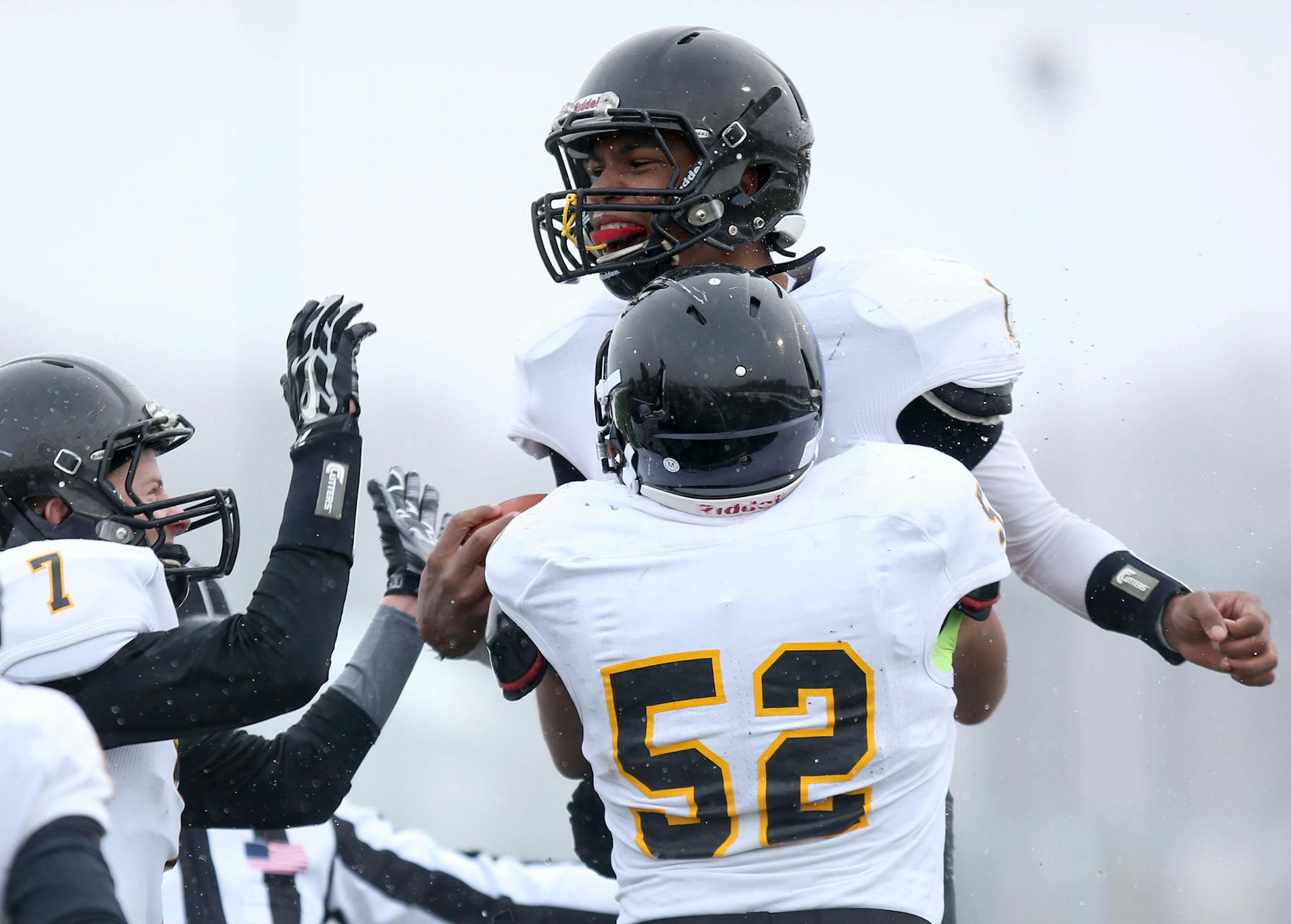 DeLa Salle's Sage Booker celebrated with teammates after running for more than 40 yards into the red zone. the next play was a touchdown by quarterback Billy Hart. ] (KYNDELL HARKNESS/STAR TRIBUNE) kyndell.harkness@startribune.com DeLaSalle vs. Hutchinson state semifinals in Prior Lake, Min., Saturday, November 15, 2014. DeLaSalle won over Hutchinson 35-14.