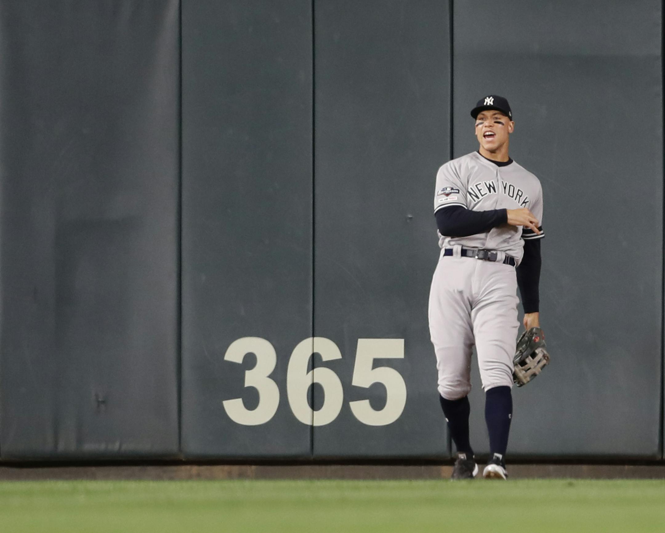 New York Yankees right fielder Aaron Judge (99) celebrated after catching a Minnesota Twins third baseman Miguel Sano (22) fly ball in the sixth inning. ] LEILA NAVIDI • Leila.navidi@startribune.com The Minnesota Twins met the New York Yankees in Game 3 of their American League Division Series Monday October 7, 2019 at Target Field.