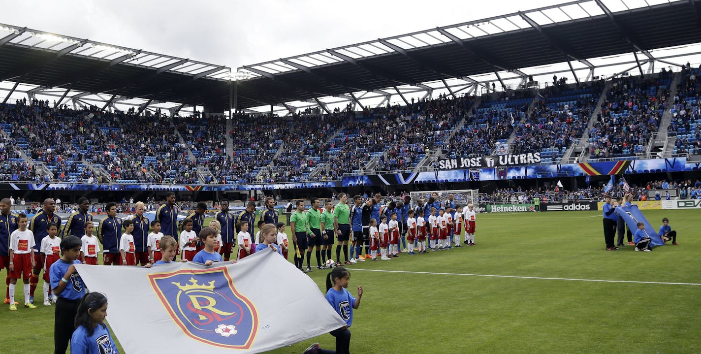 The San Jose Earthquakes, at right, and Real Salt Lake line up for the national anthem during before an MLS soccer game Sunday, April 5, 2015, in San Jose, Calif. (AP Photo/Marcio Jose Sanchez)