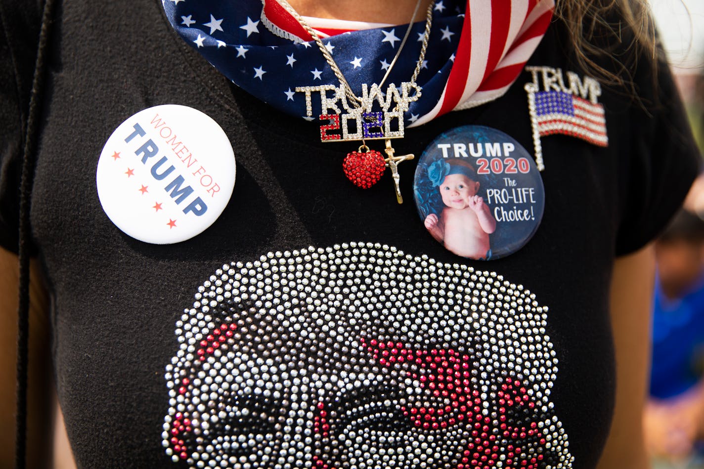 FILE Ñ An attendee at Donald TrumpÕs rally at a county fairgrounds in Wellington, Ohio, June 26, 2021. Much as he did while in the White House, Donald Trump has thoroughly blurred the lines between his political ambitions and his business interests, with a wide-ranging set of moneymaking ventures. (Maddie McGarvey/The New York Times)