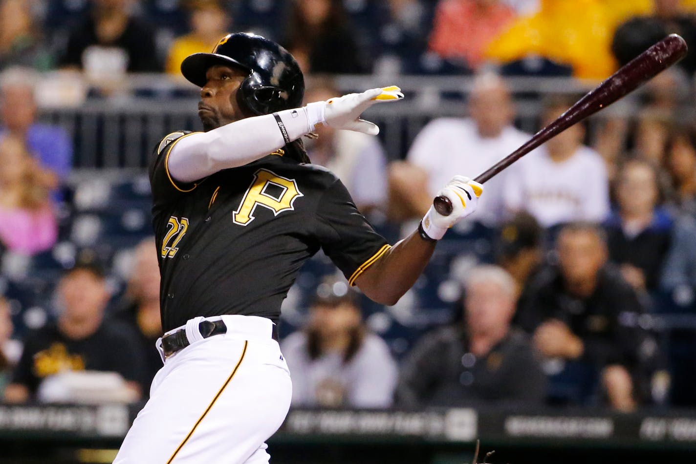 Pittsburgh Pirates' Andrew McCutchen (22) hits a two-run home run off Chicago Cubs starting pitcher Jason Hammel during the first inning of a baseball game in Pittsburgh Wednesday, June 11, 2014. (AP Photo/Gene J. Puskar)