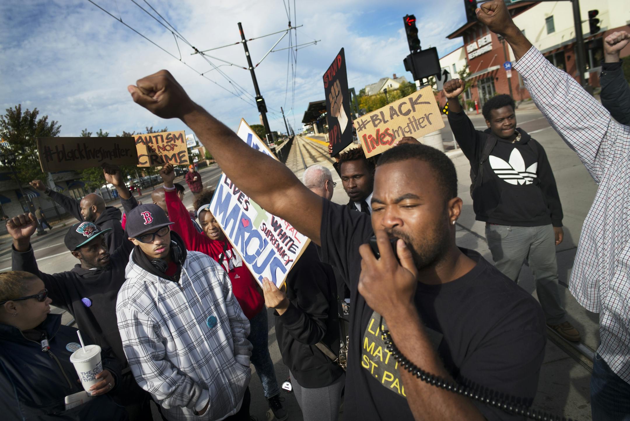 Near the Lexington light rail station in St. Paul, protesters with Black Lives Matters blocked traffic to and from TCF Stadium on the home opener for the Vikings. Organizer Rashad Turner, front, led the event.