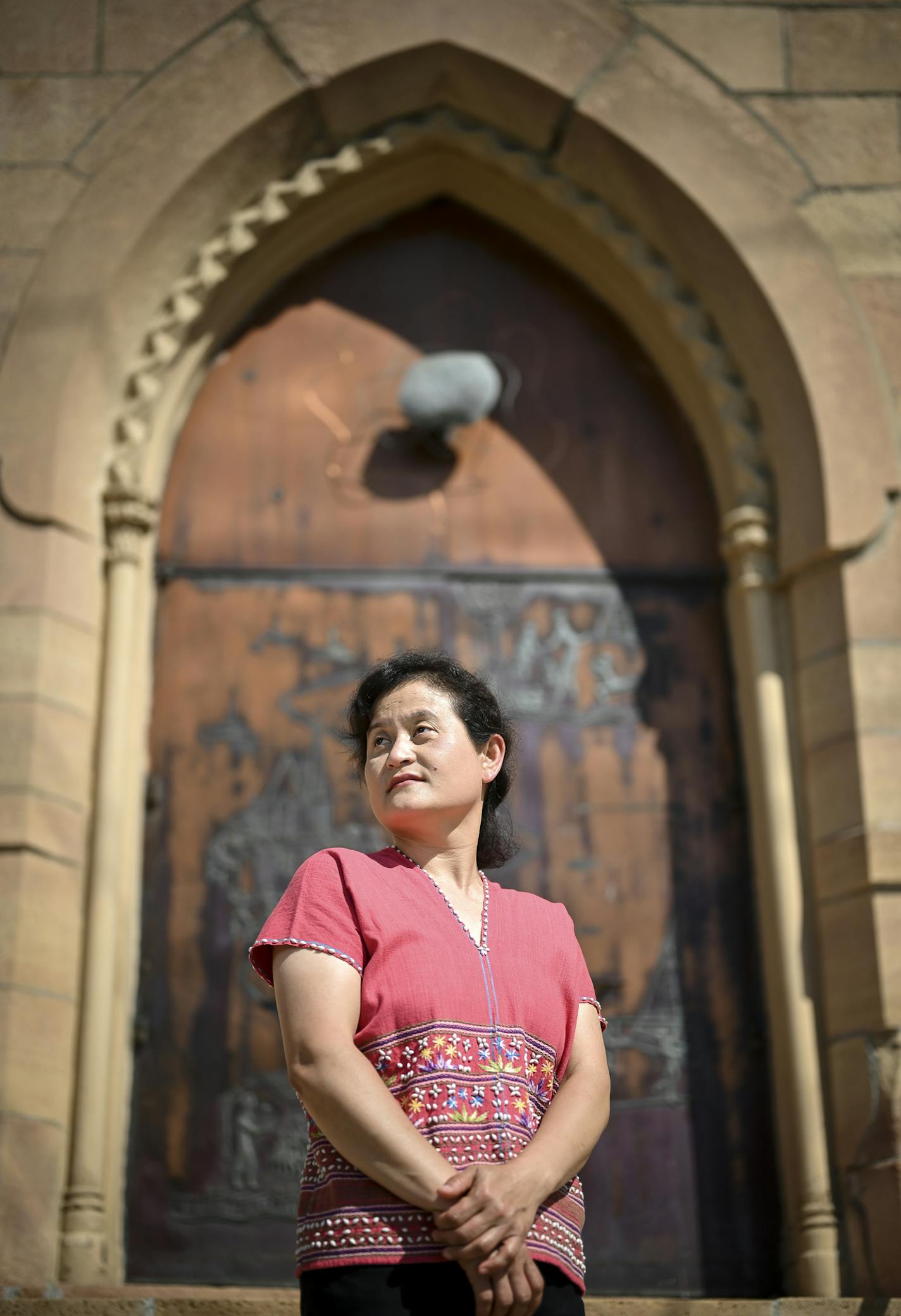 Lwepaw Kacher was photographed outside Hope Community Church, the church she attends, in Lowertown, St. Paul on Friday, July 3, 2020. Kacher is a Karen refugee. But unlike the sizable population that settled here in the last dozen years, Kacher came to the U.S. in the mid-1990s. Her longtime familiarity with U.S. systems, experience in healthcare and fluency in English primed her for her job as a cultural broker for M Health Fairview working with the Karen population, which often has limited Eng