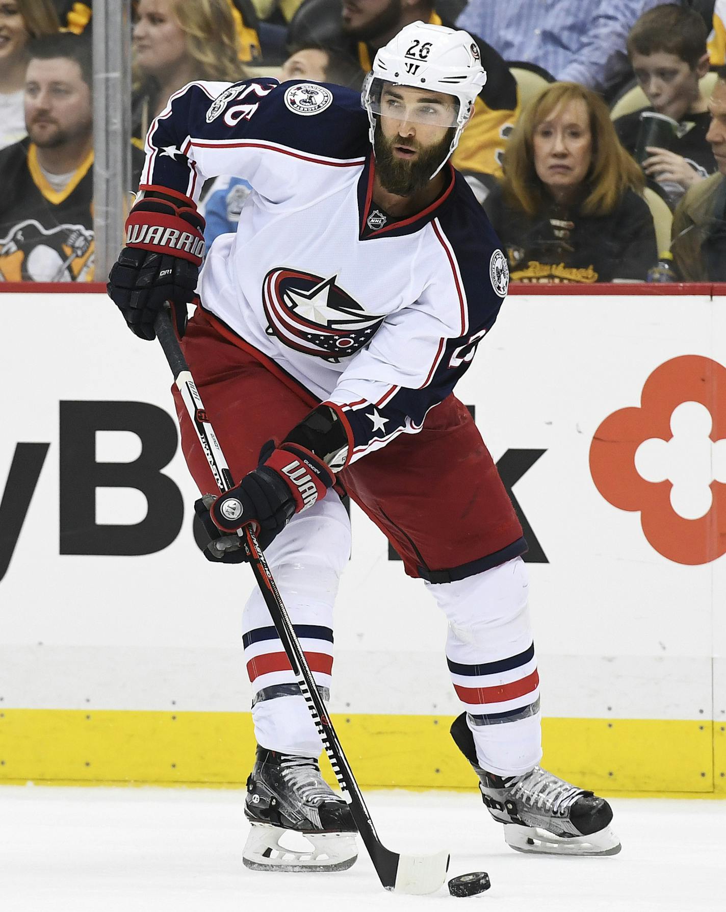 PITTSBURGH, PA - APRIL 4: Columbus Blue Jackets Defenseman Kyle Quincey (26) moves the puck during the second period in the NHL game between the Pittsburgh Penguins and the Columbus Blue Jackets on April 4, 2017, at PPG Paints Arena in Pittsburgh, PA. The Penguins defeated the Blue Jackets 4-1. (Photo by Jeanine Leech/Icon Sportswire) (Icon Sportswire via AP Images) ORG XMIT: 268423