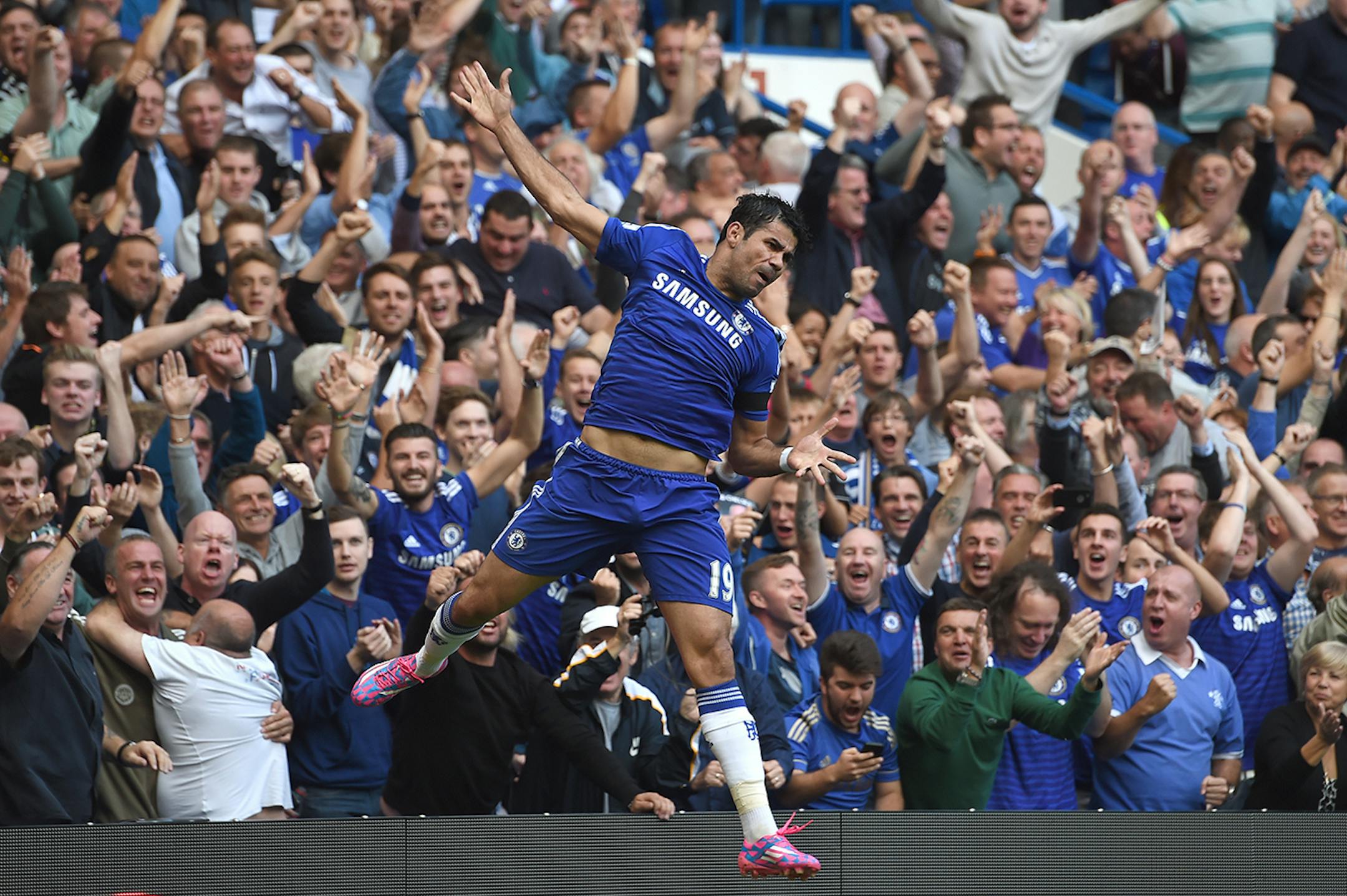 Chelseaís Diego Costa celebrates scoring his side's second goal against Swansea City during their English Premier League soccer match at Stamford Bridge, London, Saturday, Sept. 13, 2014. (AP Photo/Tim Ireland)