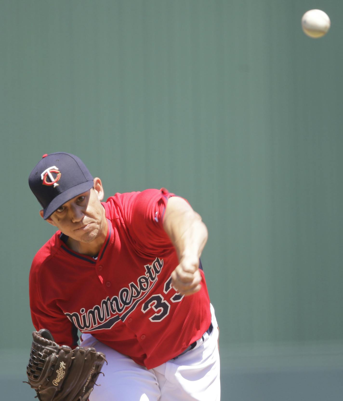 Minnesota Twins' starting pitcher Tommy Milone delivers against the New York Yankees in the first inning during an exhibition spring training baseball game, Tuesday, March 31, 2015, in Fort Myers, Fla. (AP Photo/Brynn Anderson)