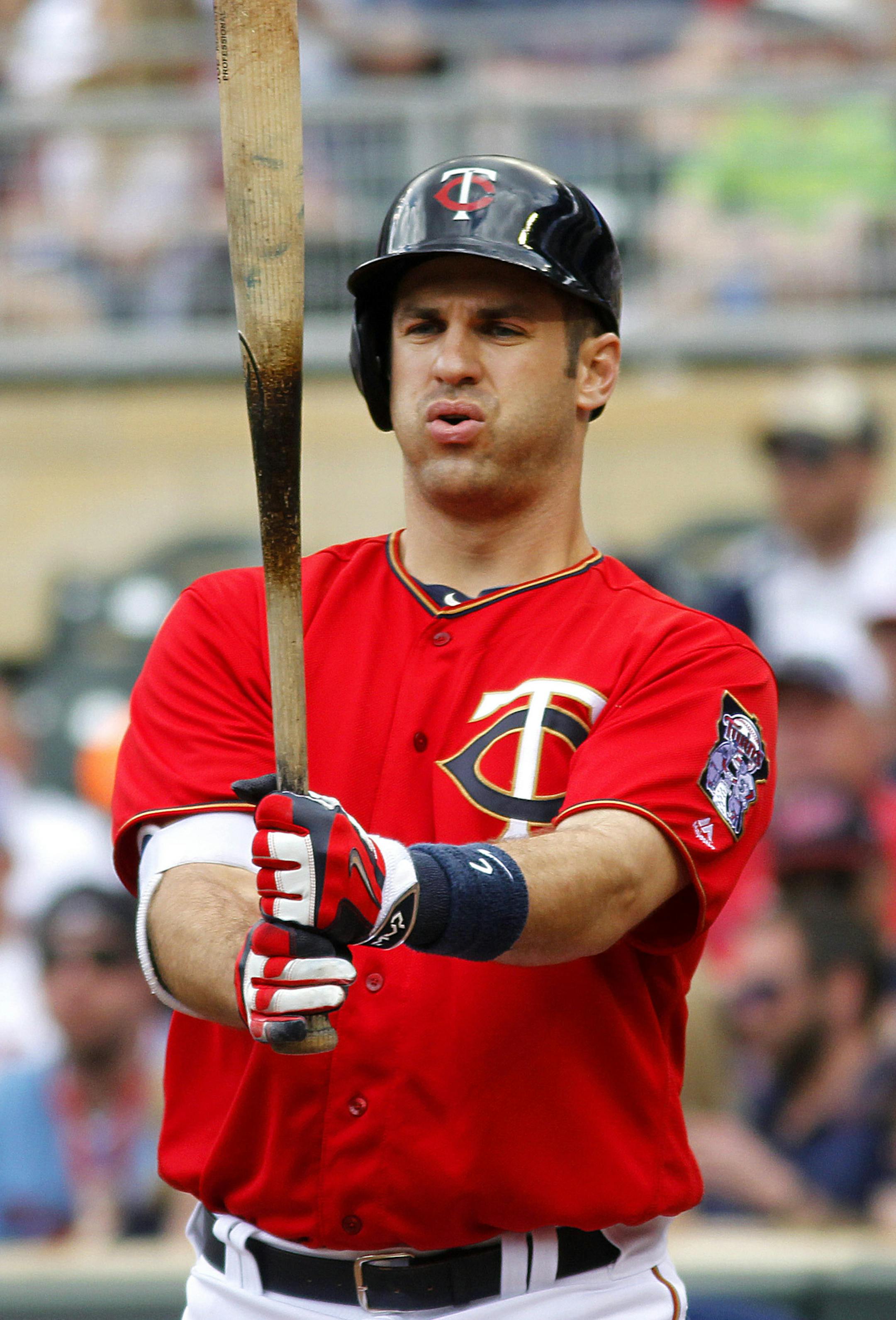 Minnesota Twins first baseman Joe Mauer prepares to bat in the first inning of a baseball game against the Los Angeles Angels on Sunday, April, 17, 2016 in Minneapolis. (AP Photo/Andy Clayton-King)