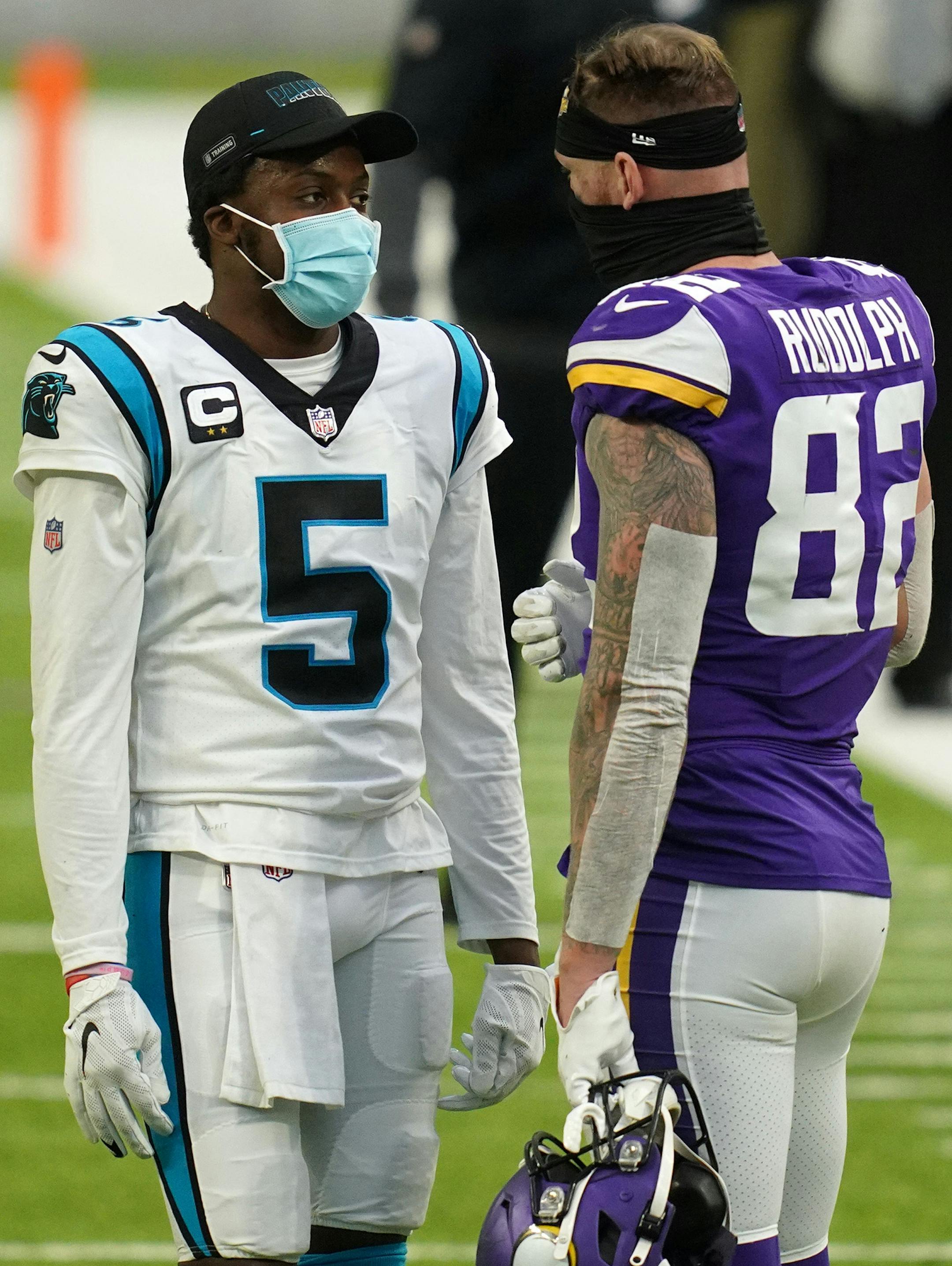Carolina Panthers quarterback Teddy Bridgewater (5) talked with Minnesota Vikings tight end Kyle Rudolph (82) on the field after the game.