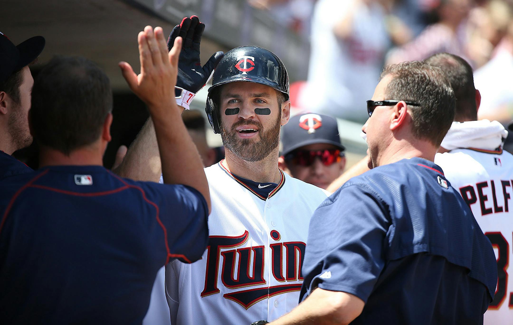 Minnesota Twins first baseman Joe Mauer was greeted by teammates after hitting a solo home run against the Cardinals in June.