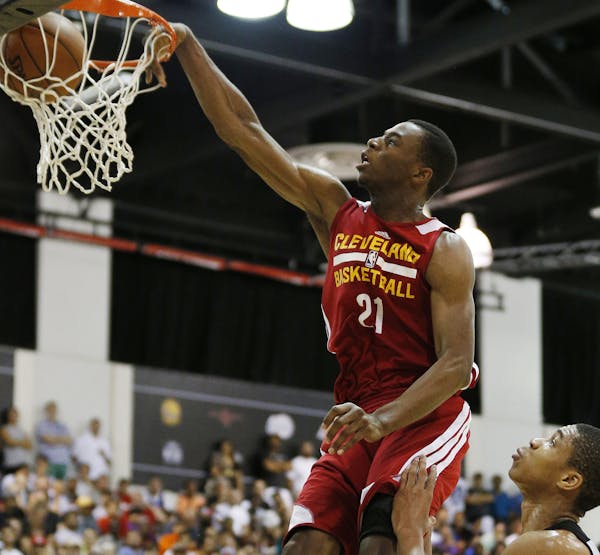 FILE - In this July 11, 2014, file photo, Cleveland Cavaliers' Andrew Wiggins, the No. 1 overall pick in the NBA draft, dunks against the Milwaukee Bu
