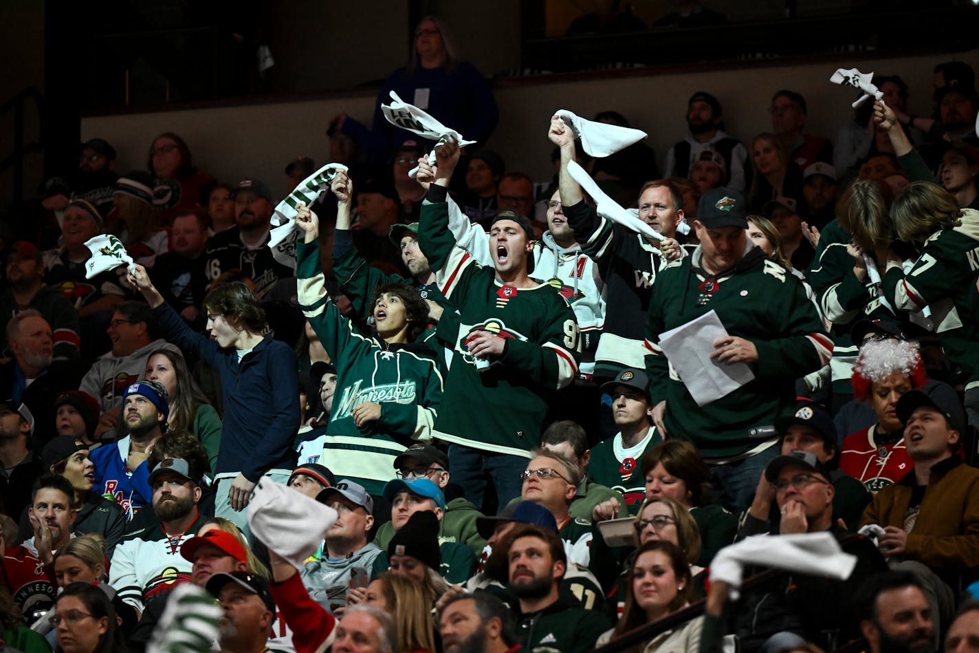 Minnesota Wild fans celebrate after a penalty is called against the New York Rangers during the second period Thursday, Oct. 13, 2022 at the Xcel Energy Center in St. Paul, Minn.. ] aaron.lavinsky@startribune.com