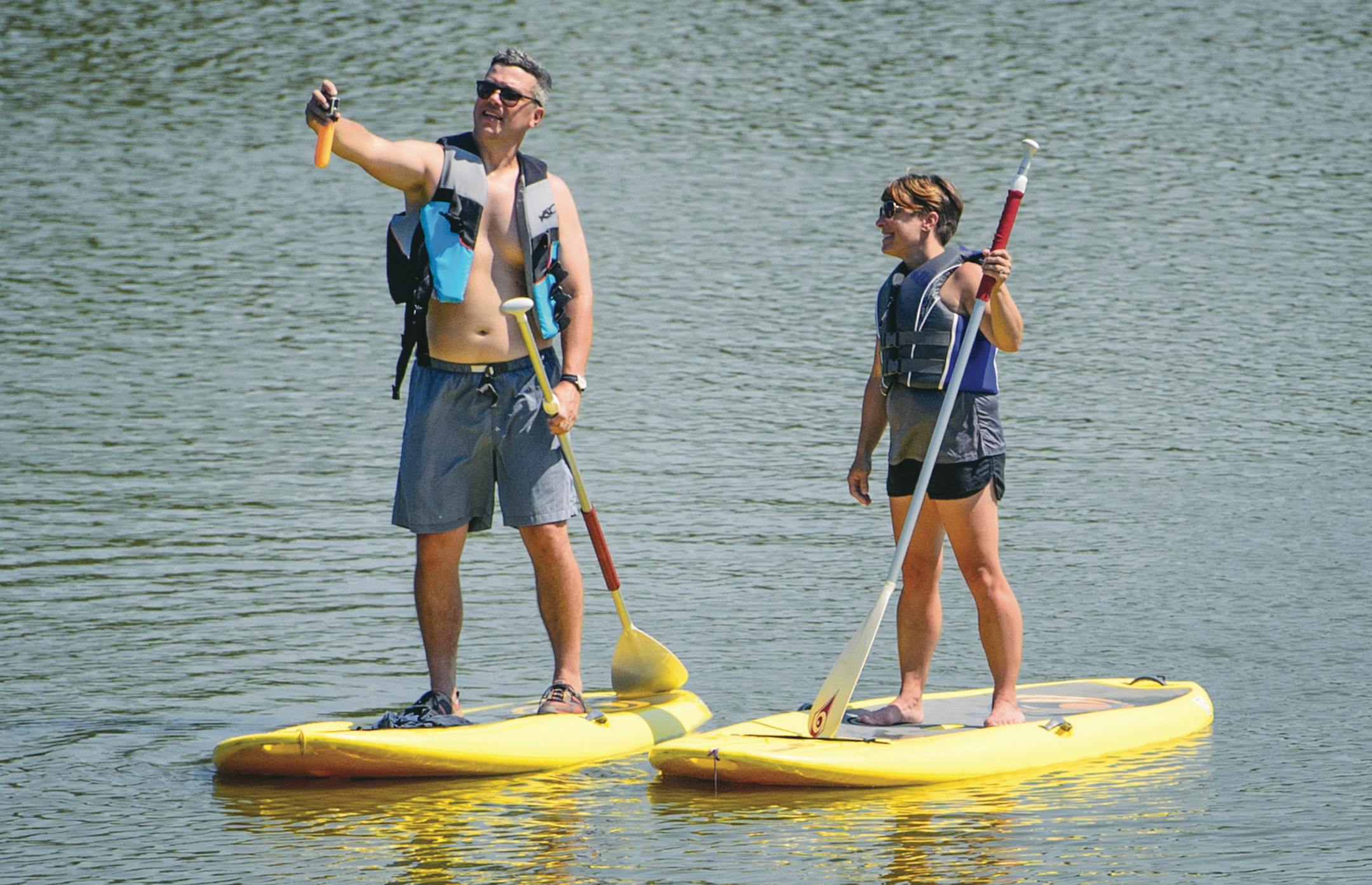 With their kids out of town and temperatures in the 90's, James and Jen Eichenberger went paddle boarding and commemorated their "paddle board date day" with a selfie before coming off Lake Como, St. Paul. Jen said "dangling your legs in the water in the middle of the lake is a great way to cool off." ] GLEN STUBBE * gstubbe@startribune.com Friday, August 14, 2015 ORG XMIT: MIN1508141510000715