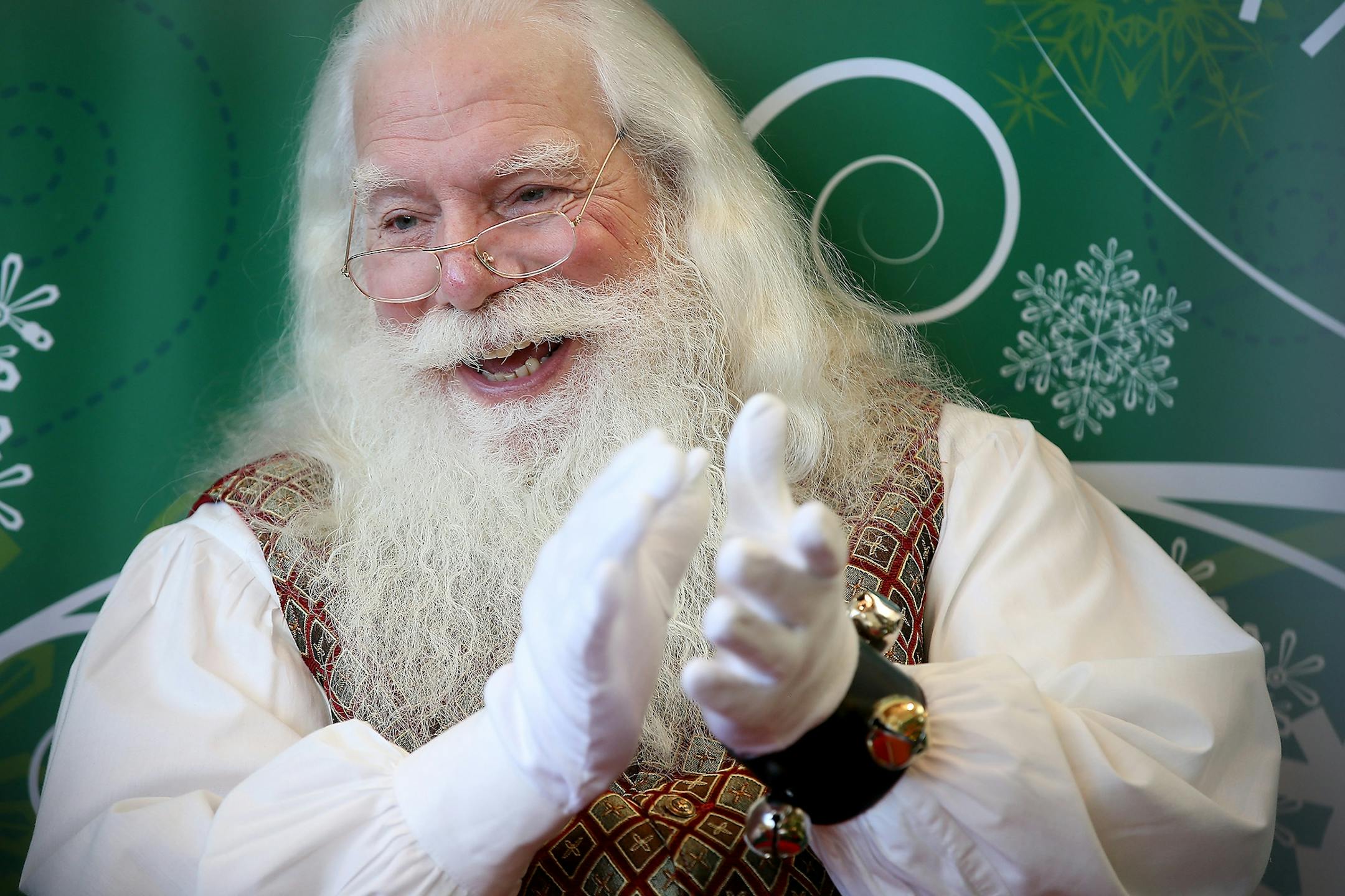 "Santa" clapped and waved to children after they sat with him for photos at Southdale Mall, Friday, December 4, 2015 in Edina, MN.