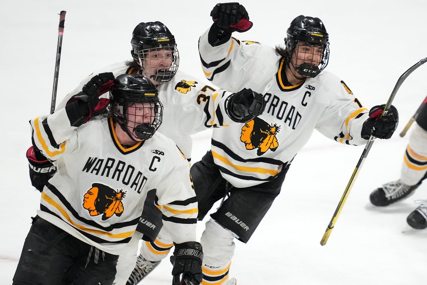 Warroad forward Matthew Hard (9) celebrates with his teammates after scoring a game winning goal in overtime of a MSHSL Class 4A semifinal boys hockey game between Warroad and Mahtomedi Friday, March 11, 2022 at the Xcel Energy Center in St. Paul, Minn. . ] ANTHONY SOUFFLE • anthony.souffle@startribune.com