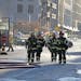 Minneapolis firefighters worked a fire in downtown Minneapolis, Thursday, November 13, 2014.