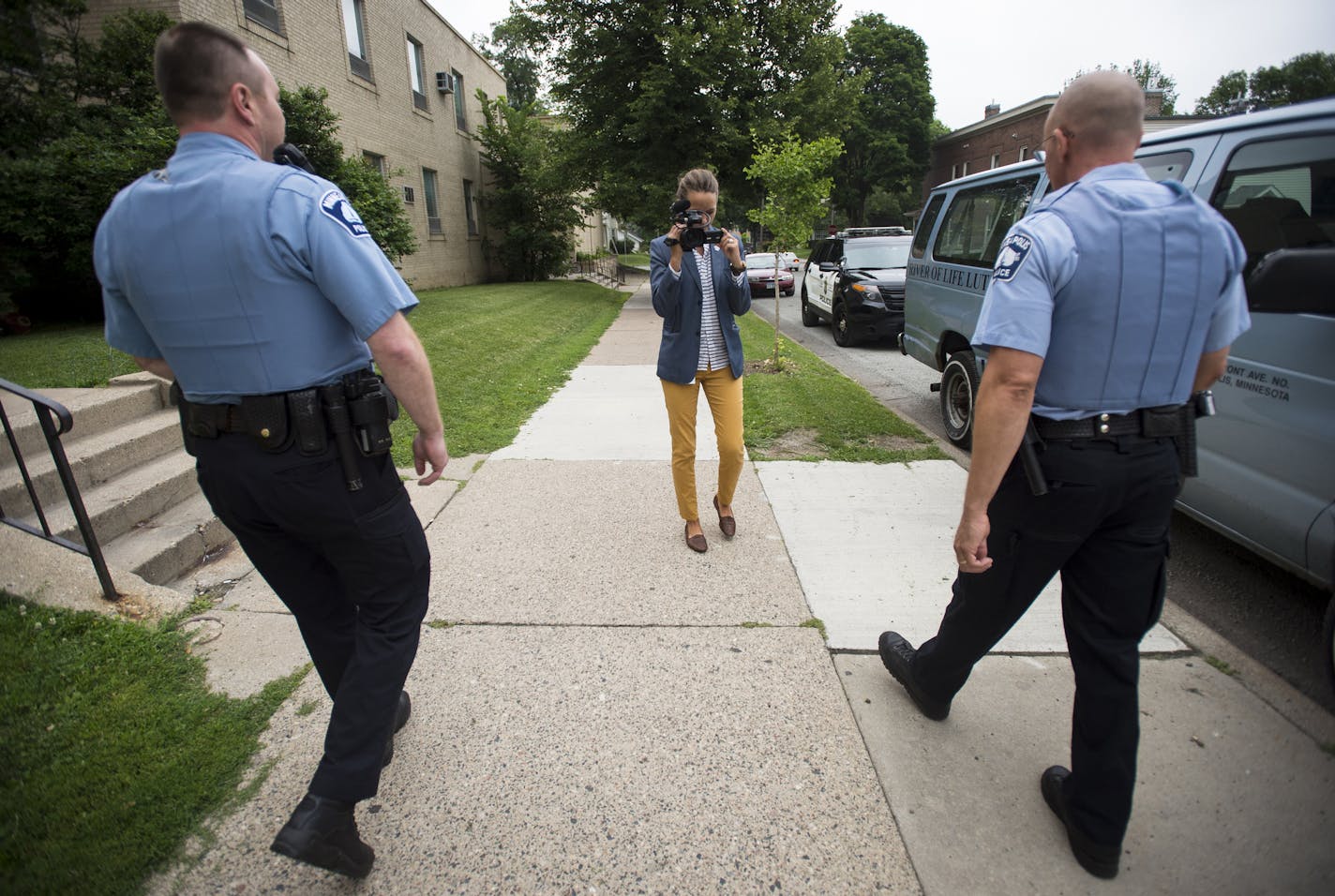 Minneapolis Police Multimedia Specialist Molly Miles shot video of officers George Warzinik, left, and Peter Hafstad as they returned to their vehicle after visiting a soup kitchen in the fourth precinct Thursday. ] Aaron Lavinsky &#x2022; aaron.lavinsky@startribune.com In an attempt to counter negative images of police and promote transparency, Minneapolis police have hired a multimedia journalist whose job is to tell the stories that news media does not tell about police. At the same time the