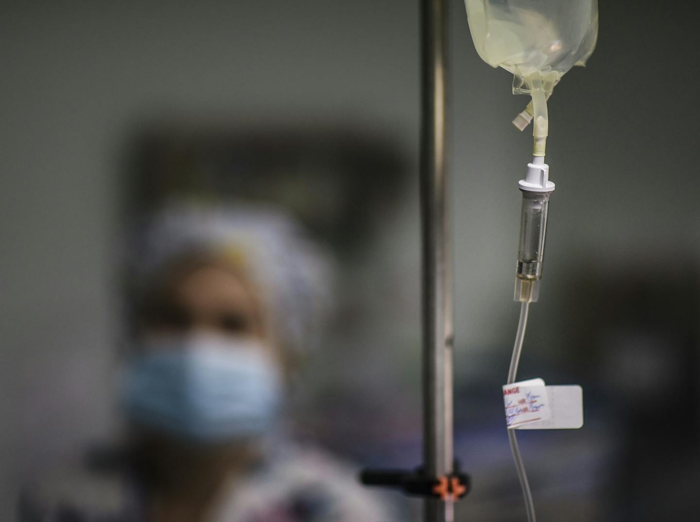 In this Oct. 7, 2016 photo, a nurse provides assistance to the surgical staff at the Dr. Isaac Gonzalez Mart&#xcc;nez Oncological Hospital in San Juan, Puerto Rico, where services are offered to cancer patients with limited financial resources. Like many doctors, nurses are also moving to the United States in search of better wages. (AP Photo/Carlos Giusti)