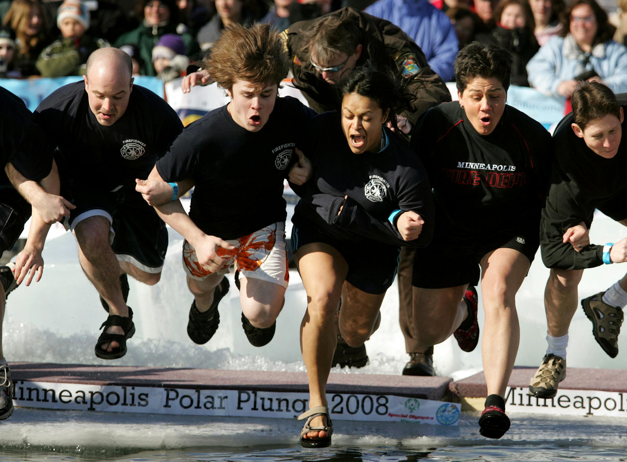 JENNIFER SIMONSON &#xef; jsimonson@startribune.com Minneapolis, MN-Mar. 1, 2008] A group of Minneapolis firefighters jumped into Lake Calhoun during a Polar Bear Plunge to raise money for Special Olympics. More than 600 people jumped into water 4-feet deep at Calhoun's Thomas Beach. The Minneapolis polar plunge raised more than $125,000, according to organizers.