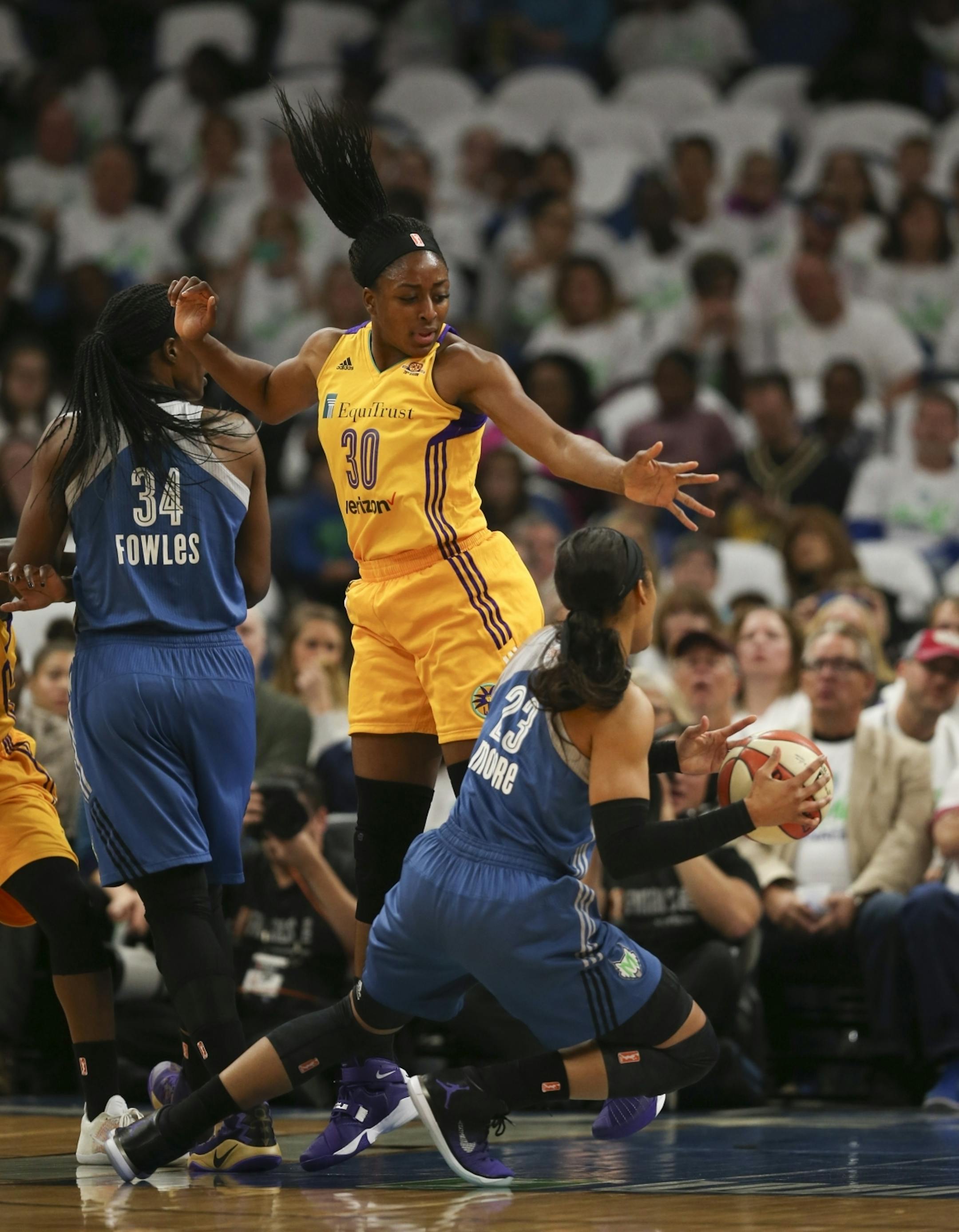Minnesota Lynx forward Maya Moore (23) was fouled by Los Angeles Sparks forward Nneka Ogwumike (30) in the first half.