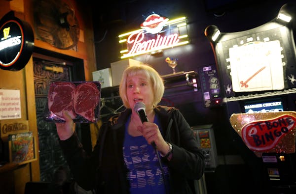 Johnna Lush held up a prize during a game of T-Bone Bingo at Grumpy's Bar in Northeast Minneapolis.