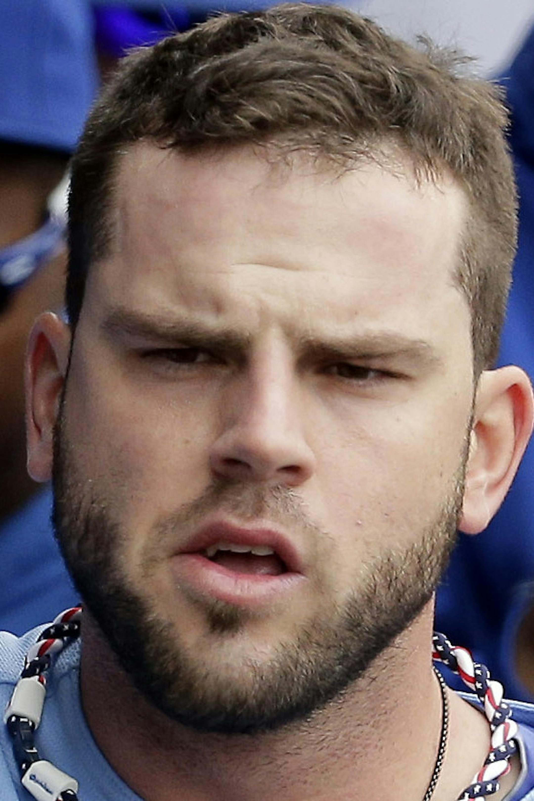 Kansas City Royals' Mike Moustakas celebrates in the dugout after hitting a three-run double during the second inning of a baseball game against the Colorado Rockies Wednesday, May 14, 2014 in Kansas City, Mo. (AP Photo/Charlie Riedel)