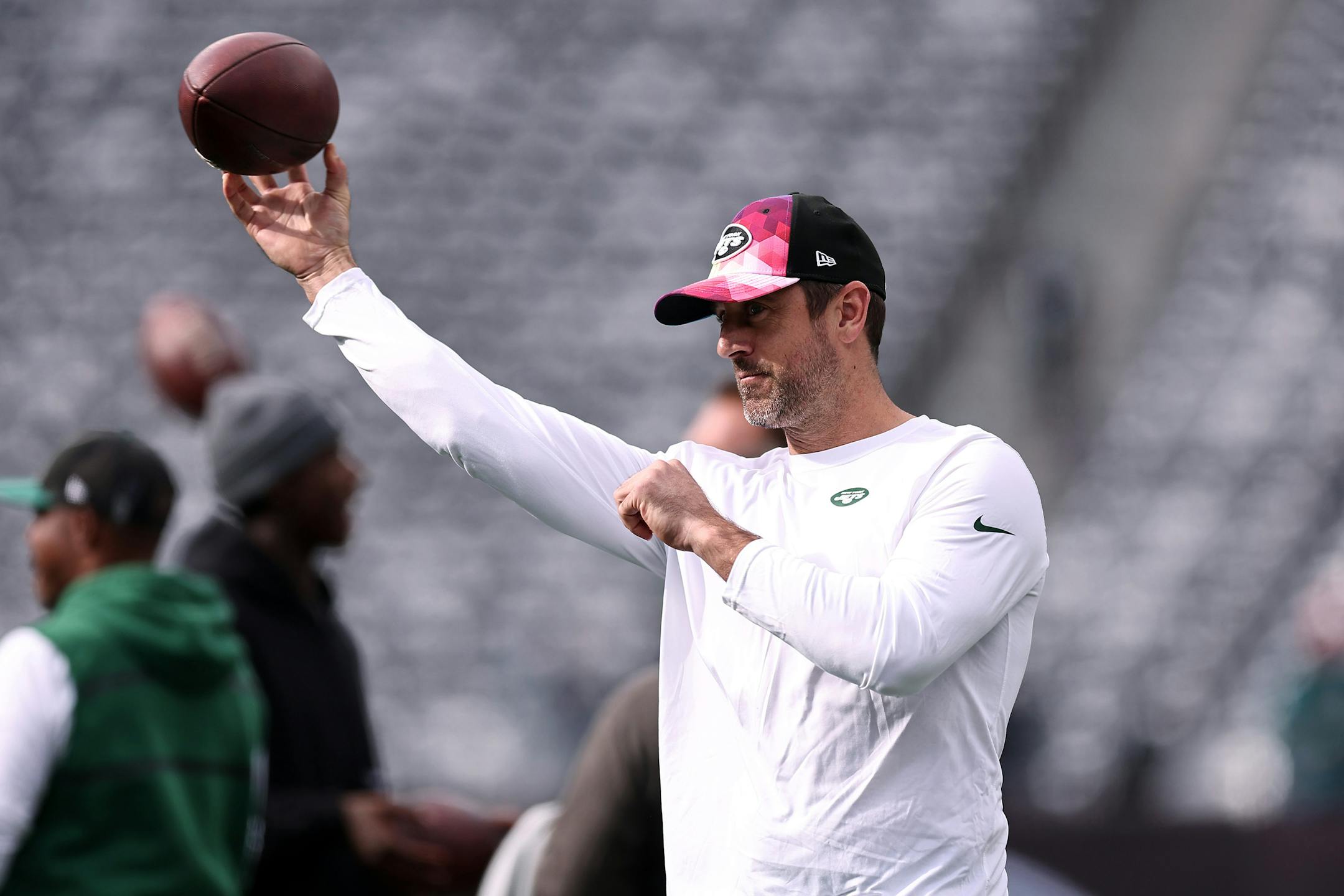 Jets quarterback Aaron Rodgers, shown throwing before a game against the Eagles on Nov. 15, has been cleared to practice — exactly 11 weeks after having surgery for a torn Achilles tendon.