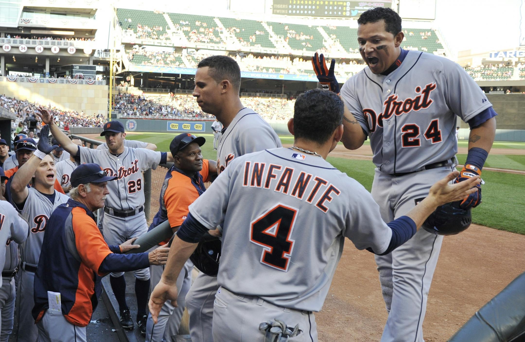 Detroit Tigers' Miguel Cabrera, right, is congratulated in the dugout after his three-run home run off Minnesota Twins' Casey Fien in the eighth inning of a baseball game Saturday, Sept. 29, 2012, in Minneapolis.