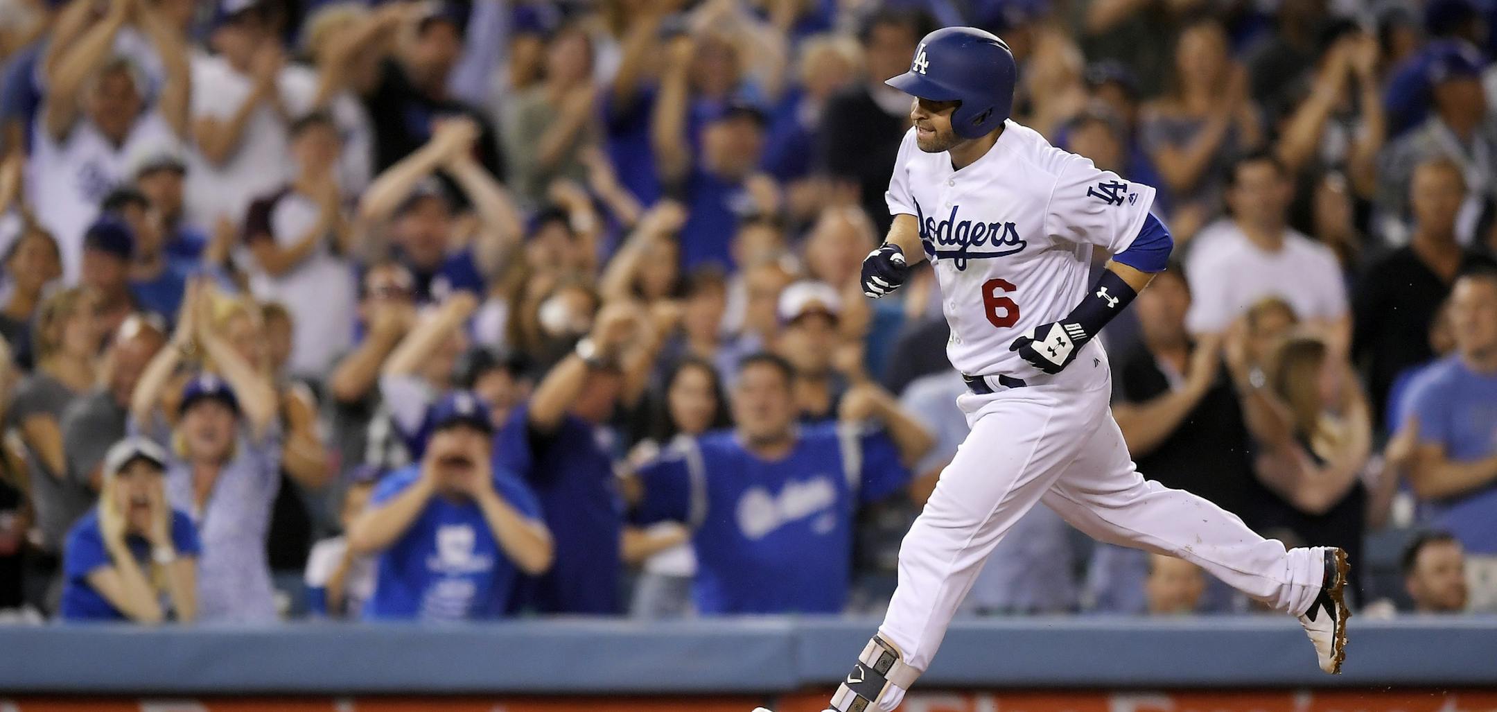 Los Angeles Dodgers' Brian Dozier rounds third after hitting a solo home run during the fifth inning against the Los Angeles Dodgers in a baseball game Wednesday, Aug. 1, 2018, in Los Angeles. (AP Photo/Mark J. Terrill)