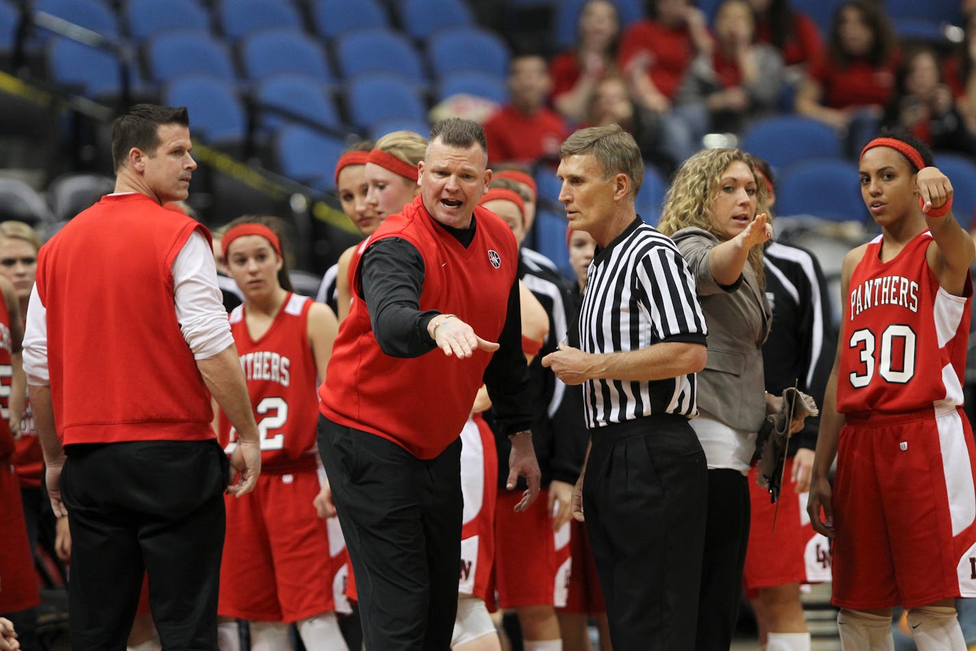 JEFF WHEELER â€¢ jeff.wheeler@startribune.com MINNEAPOLIS - 3/17/11 - Eden Prairie beat Lakeville North 49-32 in their girls' basketball state tournament semi-final game Thursday evening at Target Center in Minneapolis. IN THIS PHOTO: ] Lakeville North head coach Andy Berkvam spoke with a referee after disagreeing with a second half call against one of his players Thursday night.