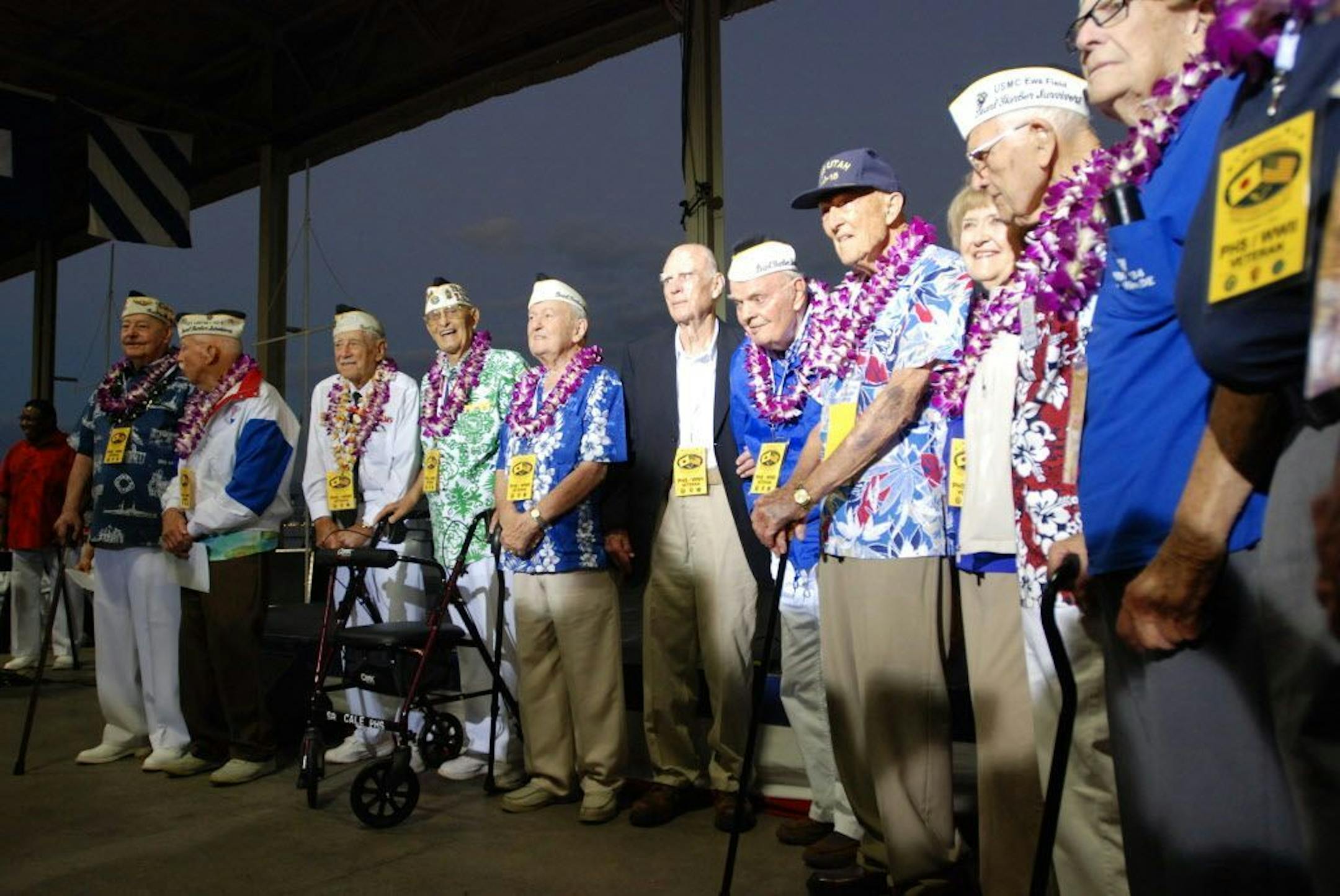 Pearl Harbor survivors gather on Monday, Dec. 7, 2015, in Pearl Harbor, Hi., before a ceremony marking the 74th anniversary of the Japanese attack that launched the U.S. into World War II.