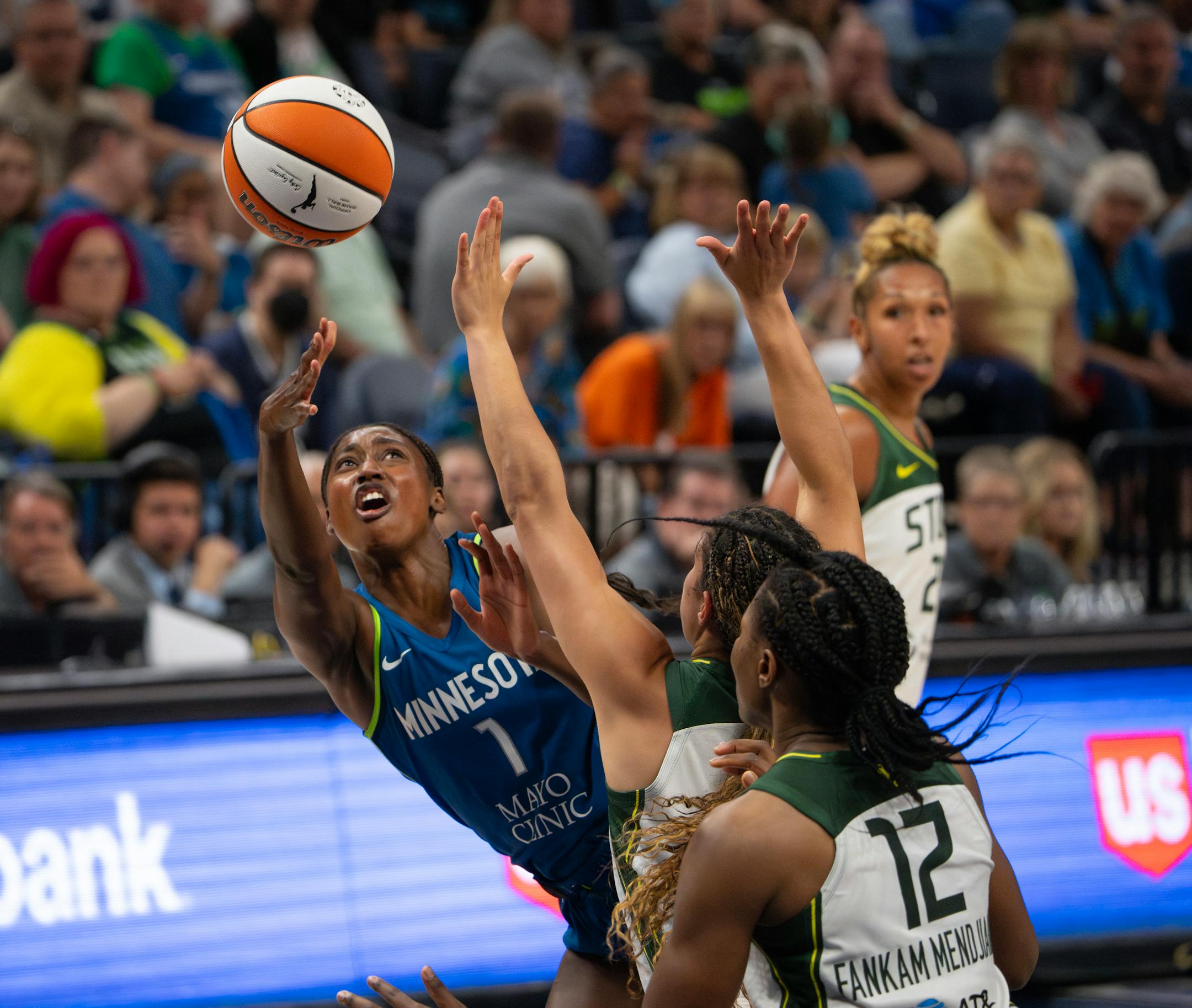 Minnesota Lynx guard Diamond Miller shot off balance around the defense of Seattle Storm guard Kia Nurse in the third quarter.