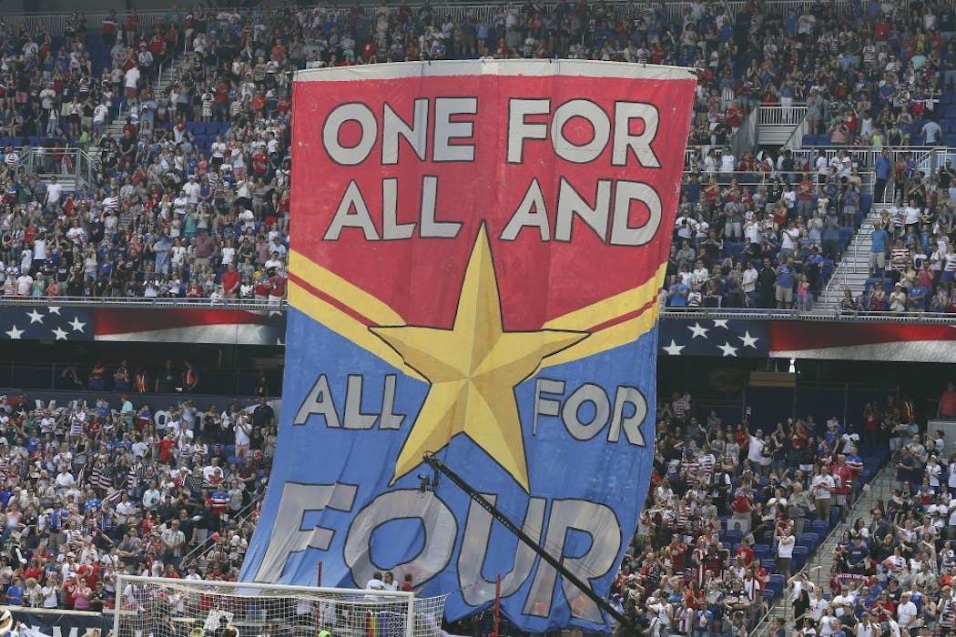 Fans hold up a banner in support of the United States women's national team before a match in New Jersey last month.