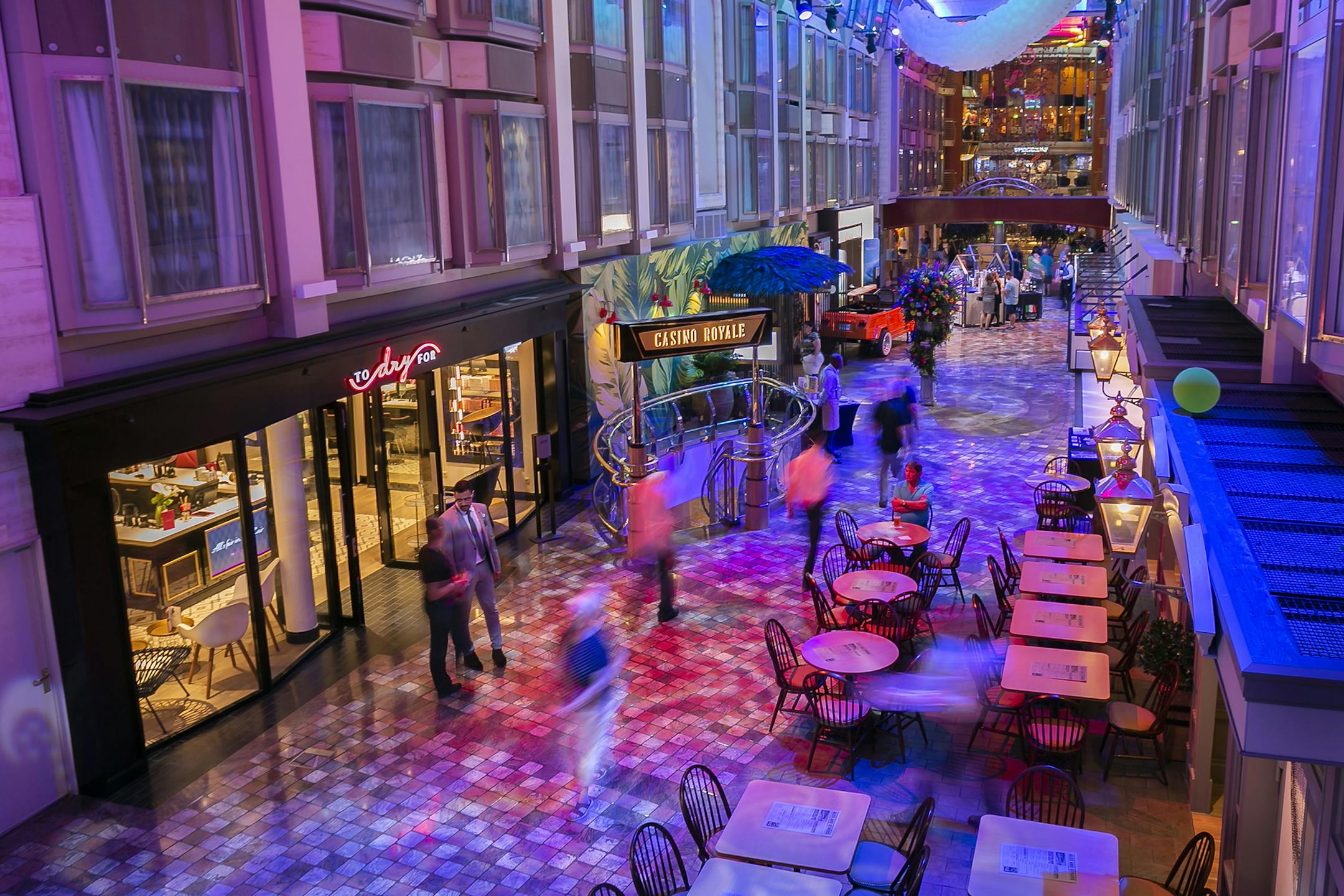 Tourists walk past the newly installed blow dry bar, To Dry For, while vacationing on Royal Caribbean's Navigator of the Seas in PortMiami on March 1, 2019. (Matias J. Ocner/Miami Herald/TNS)