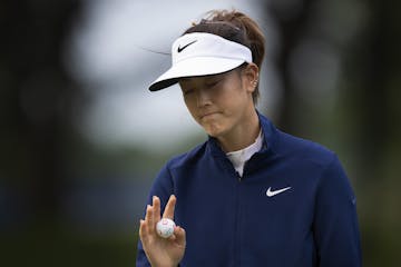 Michele Wee wave to the gallery on 15 during the second round of the KPMG Women's PGA Championship at Hazeltine National Golf Club Friday June 21 2019