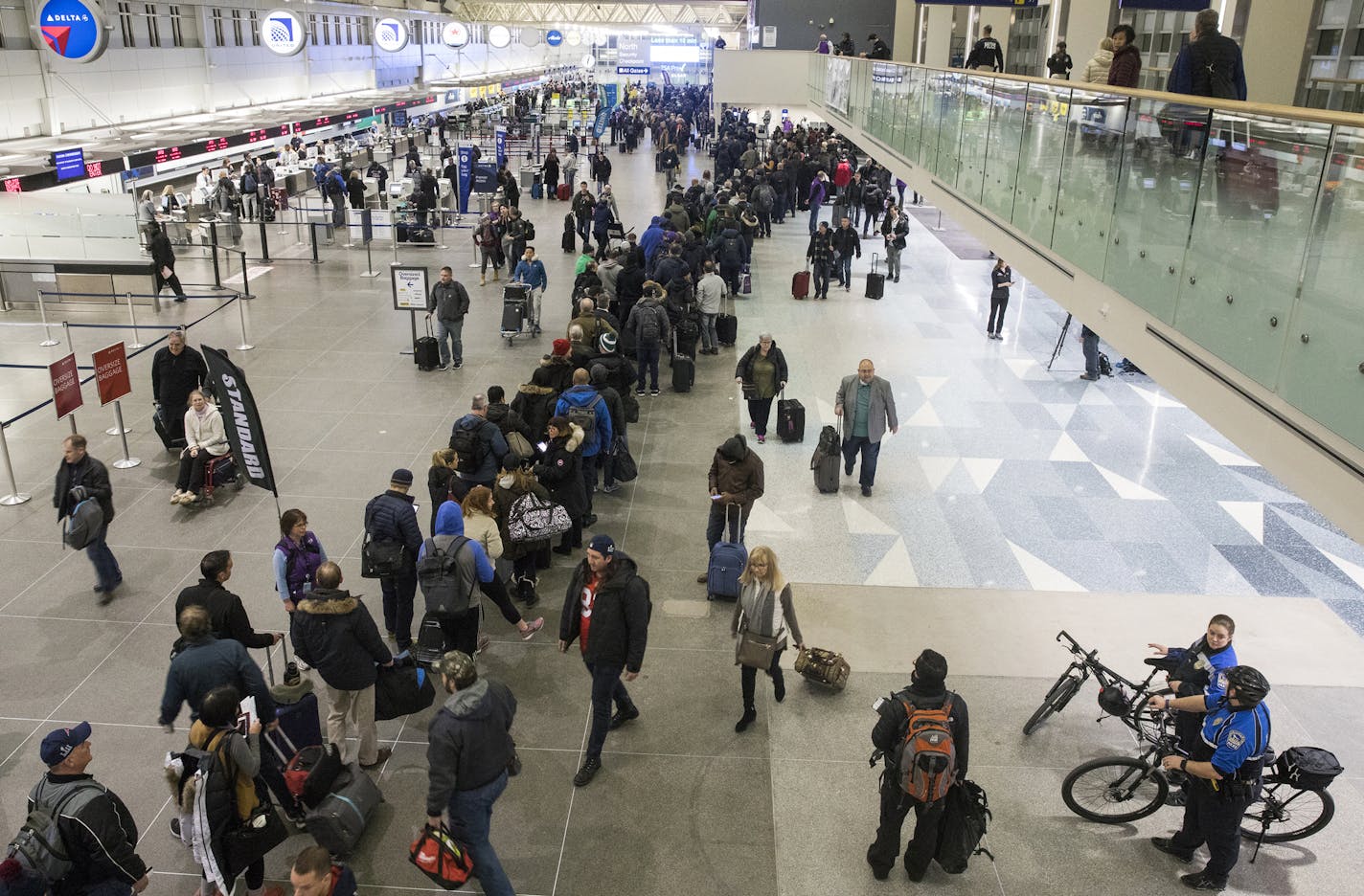 The security line stretches halfway through Terminal 1 early in the morning. ] LEILA NAVIDI &#xef; leila.navidi@startribune.com BACKGROUND INFORMATION: The scene at MSP Airport Terminal 1 on the morning after the Super Bowl on Monday, February 5, 2018.