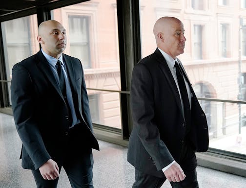 Former Minneapolis police officer J. Alexander Kueng, left, and his attorney Thomas Plunkett arrive for sentencing for violating George Floyd's civil rights outside the Federal Courthouse Wednesday, July 27, 2022 in St. Paul, Minn. ]