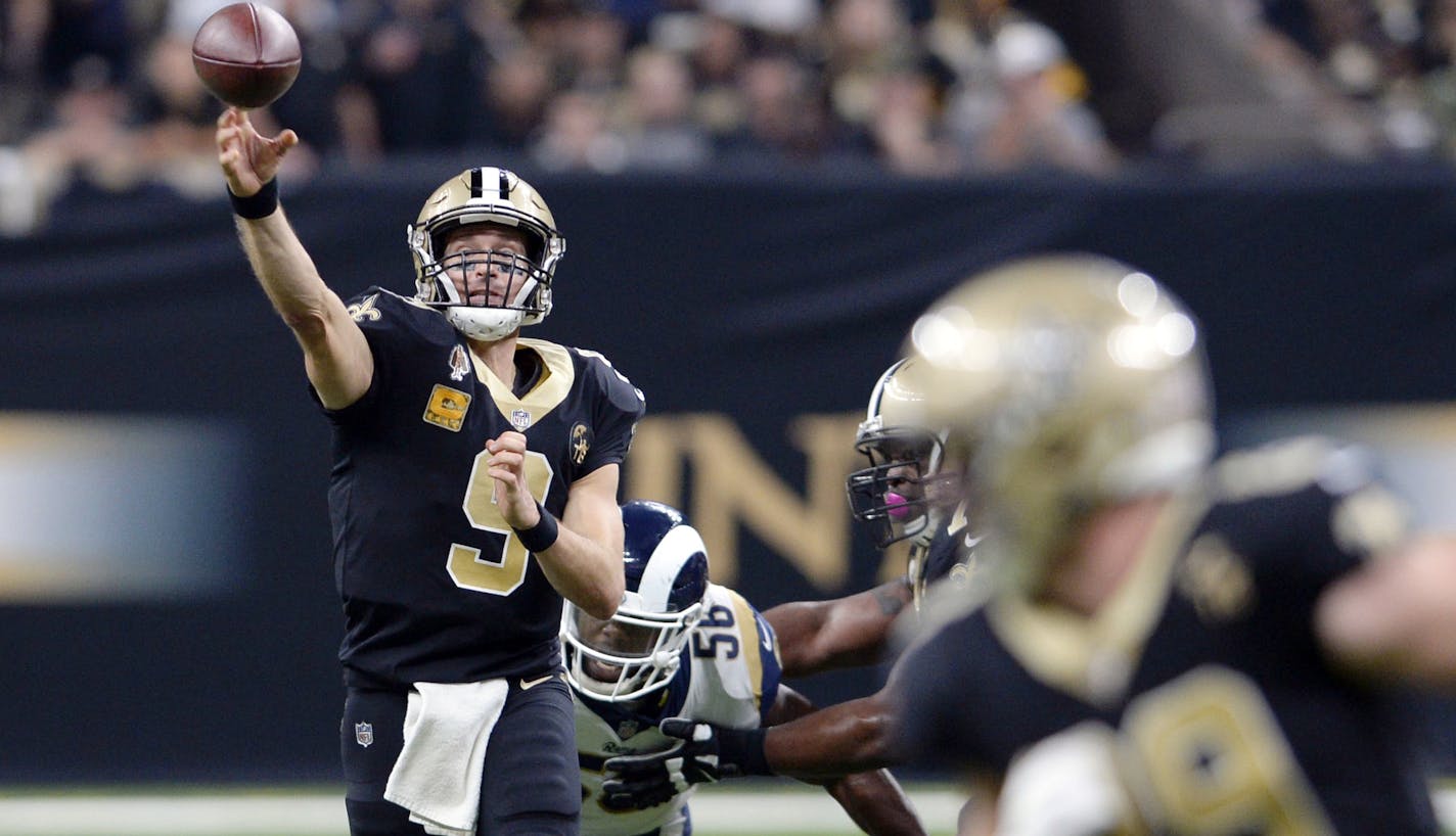 FILE - In this Sunday, Nov. 4, 2018, file photo, New Orleans Saints quarterback Drew Brees (9) throws a pass in the first half of an NFL football game against the Los Angeles Rams in New Orleans. Brees and the high-powered Saints face an historically bad defense at Paul Brown Stadium on Sunday. The Bengals have allowed more than 500 yards in each of the last two games. (AP Photo/Bill Feig, File) ORG XMIT: NYDD246