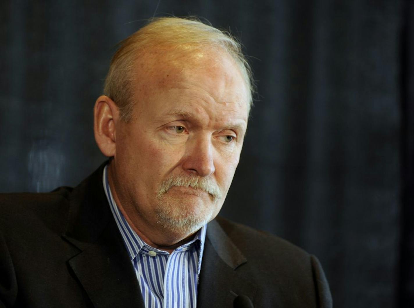 Lindy Ruff pauses during a press conference in his first public appearance two days after being fired as the Buffalo Sabres.