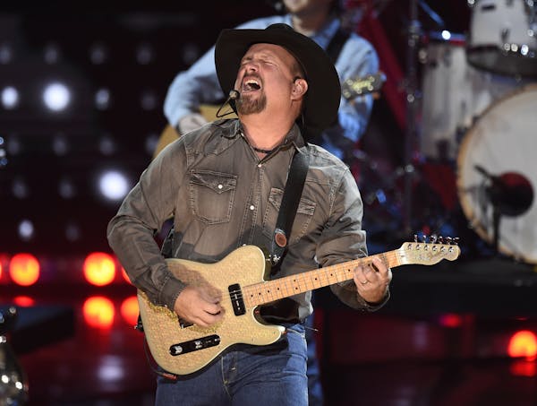 FILE - This March 14, 2019 file photo shows Garth Brooks performing at the iHeartRadio Music Awards in Los Angeles. Brooks is holding a concert in Nas