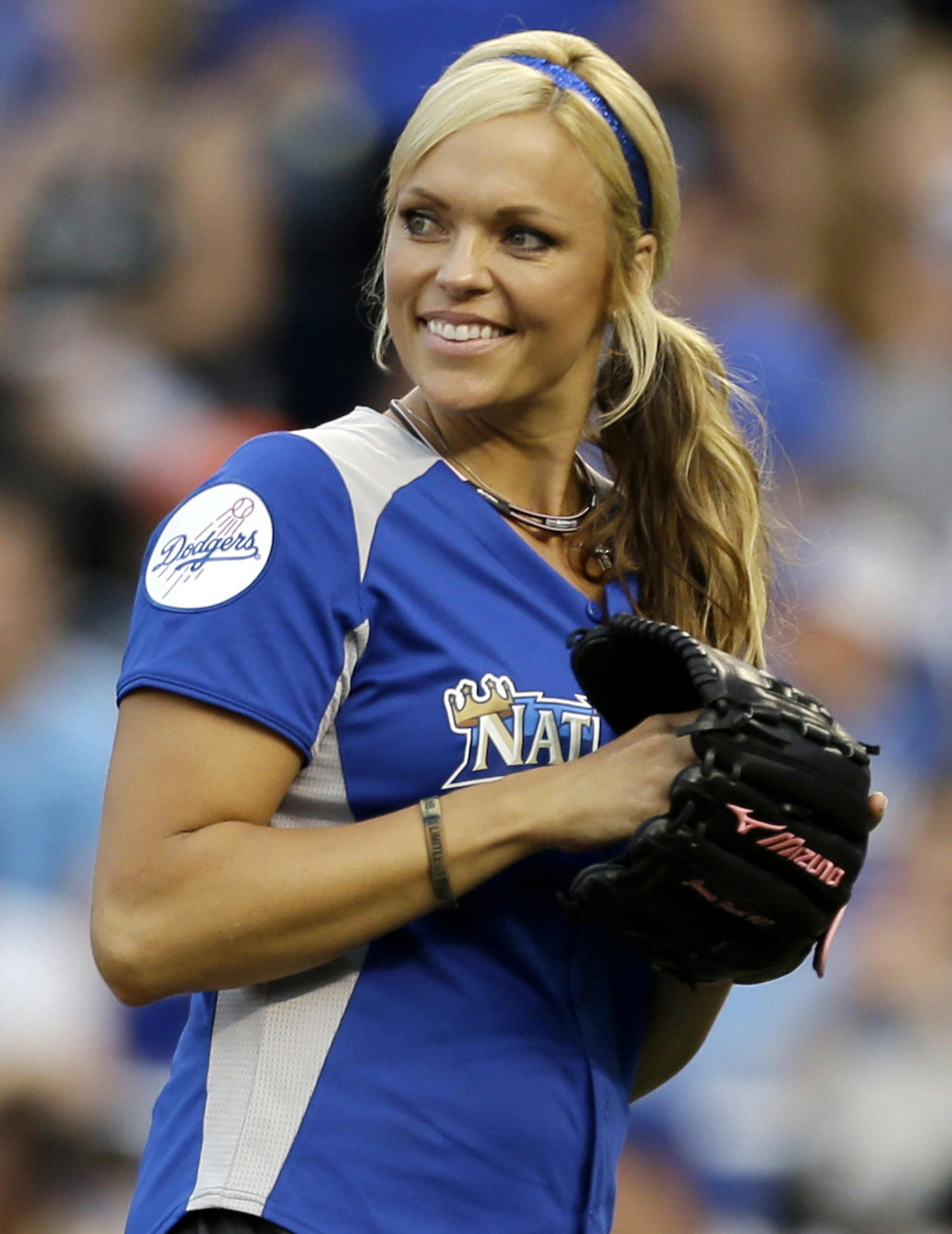 Former softball player Jennie Finch prepares to pitch during the first inning of the MLB All-Star celebrity softball game, Sunday, July 8, 2012, in Kansas City, Mo. (AP Photo/Jeff Roberson) ORG XMIT: MOKS139