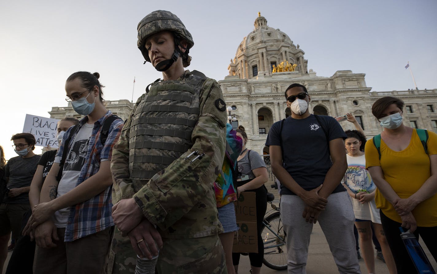 First LT. Andrea Drost of the Minnesota army national guard joined protesters in a moment of prayer at the Minnesota State Capitol in St. Paul. ] CARLOS GONZALEZ • cgonzalez@startribune.com – Minneapolis, MN – June 1, 2020, Police Protest - man died after a confrontation with Minneapolis on Monday evening. A bystander video that started circulating sometime after the incident appeared to show the man pleading with officers that he couldn't breathe - George Floyd