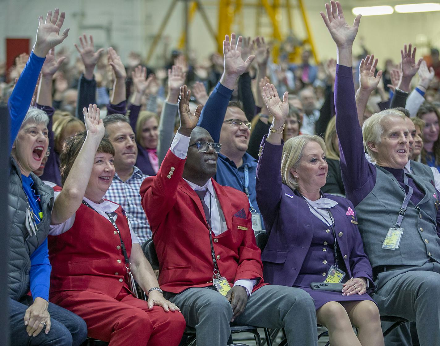 Delta Air Lines employees raised their hands if they worked more than 10 years as they celebrated its 10-year anniversary of the Northwest merger (the U.S. DOJ officially approved the merger Oct. 29, 2008) during a party at the MSP hangar, Monday, October 29, 2018 in Bloomington, MN. About 600 employees showed up for a live stream connecting Minneapolis and Atlanta hangar parties through a large screen led by CEO of Delta Air Lines, Ed Bastian in Atlanta. ] ELIZABETH FLORES &#xef; liz.flores@sta