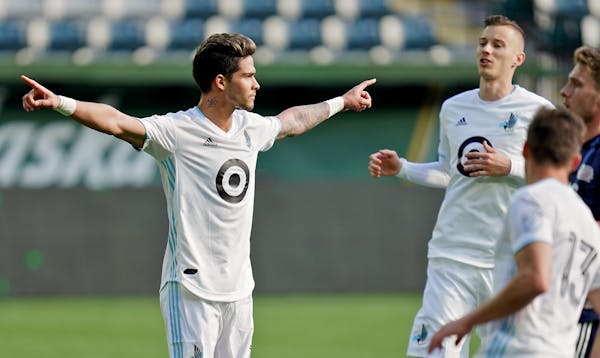 Minnesota United forward Luis Amarilla (9) reacts after scoring a goal during a preseason match against the New England Revolution at Providence Park 