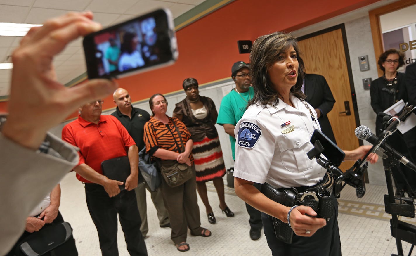 In this August 2013 file photo, Minneapolis Police Chief Janee Harteau talked to the media after a closed door meeting with community leaders on how to improve relations with the police department. The meeting came in response to the incident in Green Bay involving two Minneapolis cops.