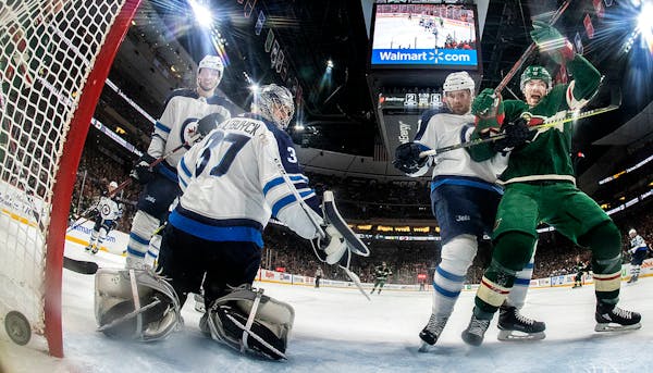 Marcus Foligno (17) celebrated after shooting the puck past Connor Hellebuyck (37) for a goal in the second period.