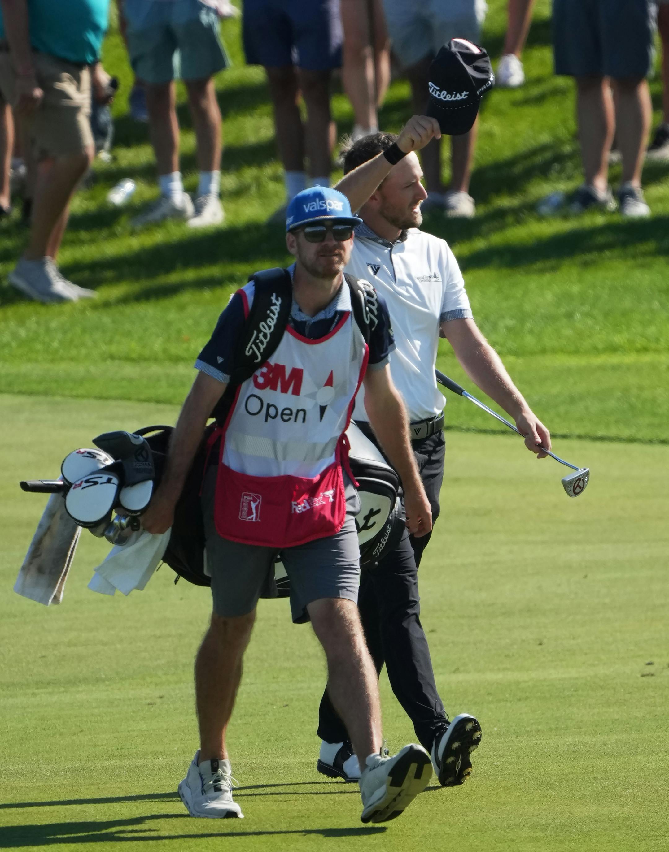 Lee Hodges acknowledges the crowd on the way to the 18th green at TPC Twin Cities Sunday.