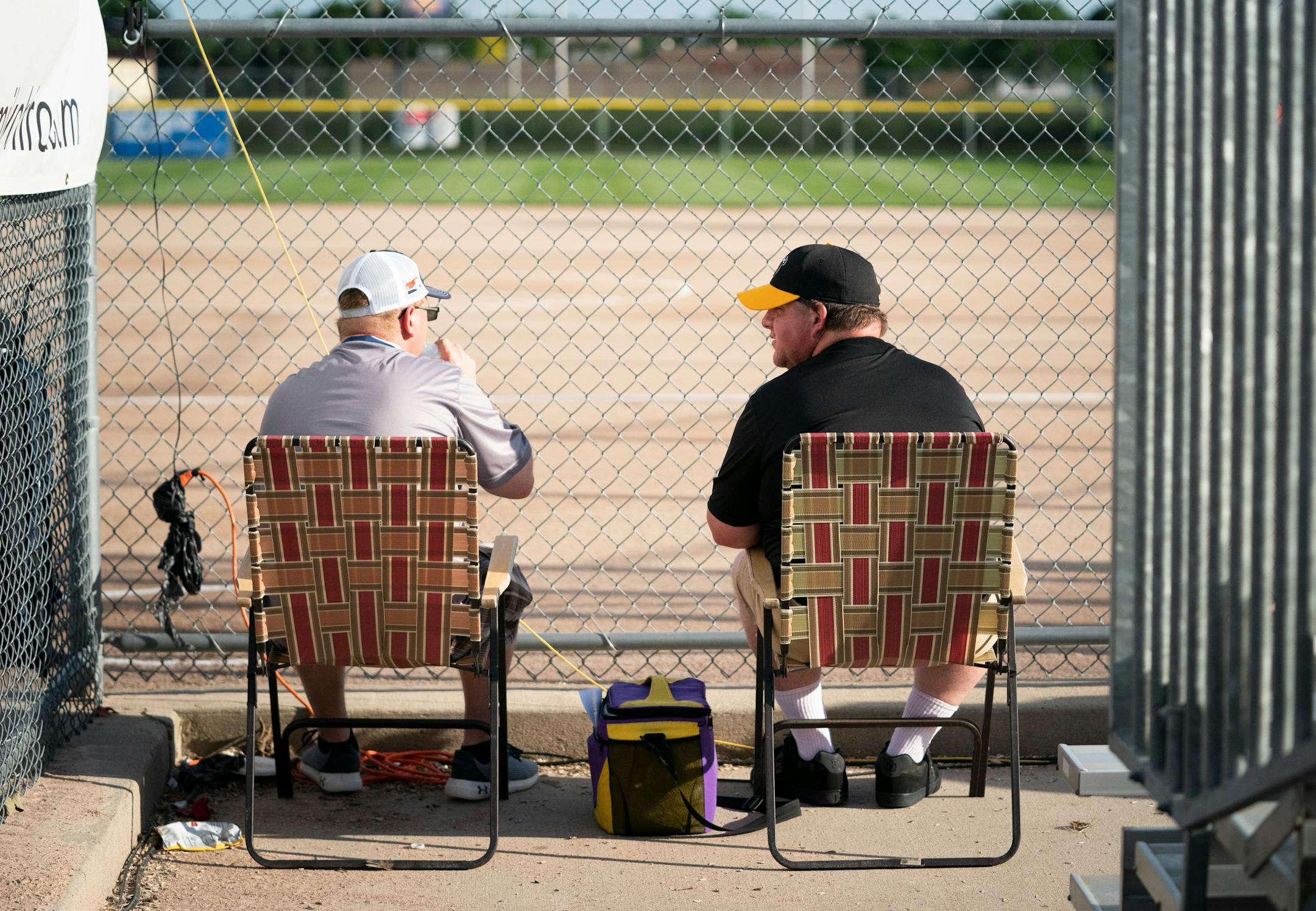 Jimmy Brandt and Matt Bauer, who are big fans and come to every Aussie Pepper game, got front row seats as they arrived early for a game against the Canadian Wild in North Mankato, Minn. Wednesday, July 3, 2019. ] RENEE JONES SCHNEIDER ¥ renee.jones@startribune.com