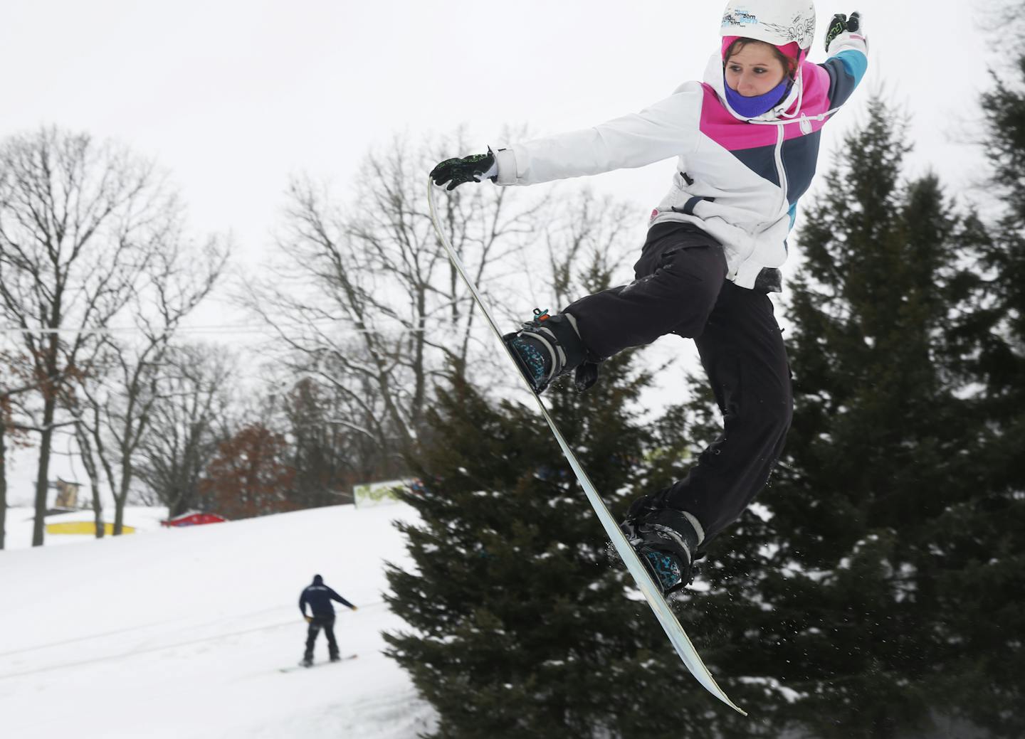 Women jumping off the snowboard