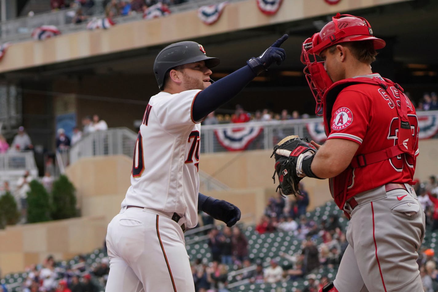 Caleb Hamilton waves to the fans after his solo homer off Los Angeles Angels relief pitcher Jose Quijada in the eighth inning Sunday